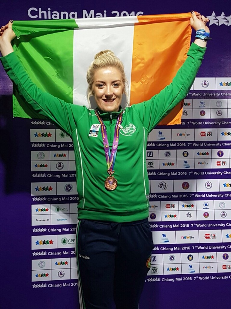 Limerick IT student Christina Desmond hold the tricolor aloft after medal ceremony in Chaing Mai at World University Boxing Championships. 