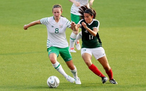 Ireland's Claire Kinsella shields the ball from Susana Gabriela Munoz Soto of Mexico in opening round of Women's Football.